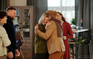 a family gathering and hugging together