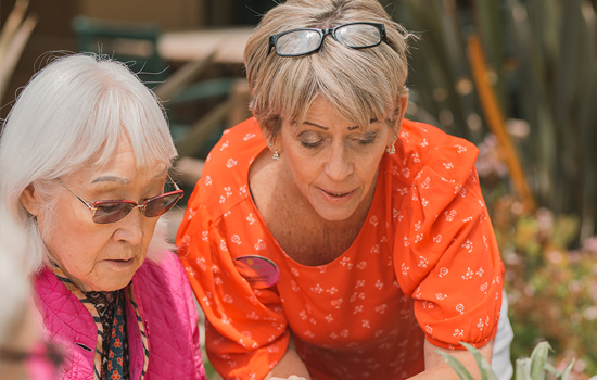 Senior resident with staff member at Summerfield of Stockton Memory Care in Stockton, CA